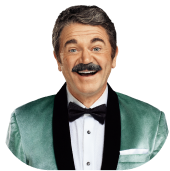 Man with mustache and tuxedo smiling