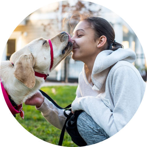 NEADS service dog licking woman