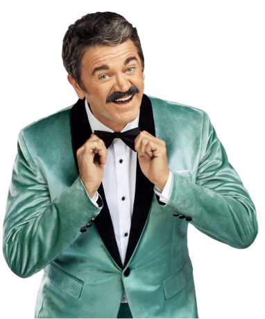 Man with mustache and tuxedo smiling